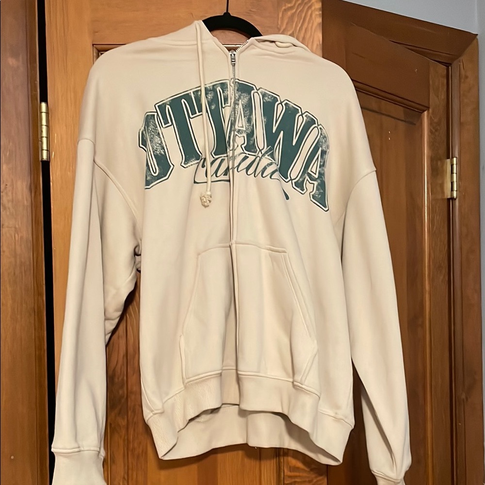 H&M Cream Zip up Hoodie with Ottawa Graphic